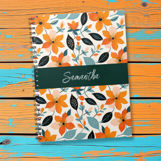 Oranje en blauw gebladerte en bloemen gepersonalis notitieboek