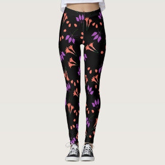 Oranje en paarse bloemmotief op zwart leggings