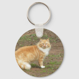 Oranje en witte drijfmest sleutelhanger