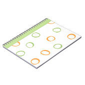 Oranje, groene laptop met geverfde retroclecircles notitieboek (Linkerzijde)