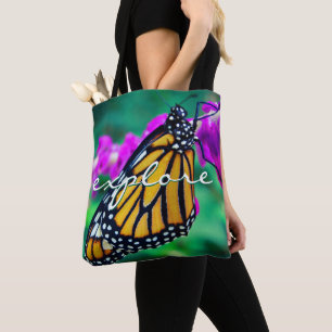 Oranje monarch vlinder verkennen script modern tote bag