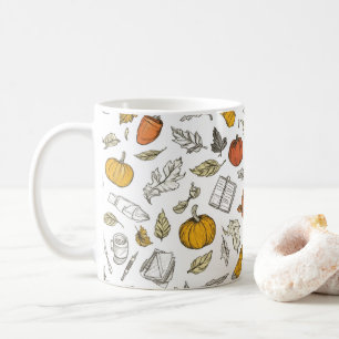 Oranje pompoenen en gegraveerde bladeren. koffiemok