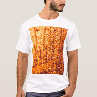Oranje regendruppels op glas, abstracte achtergron t-shirt