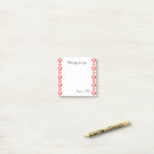 Oranje rode bloem post-it® notes (Op bureau)