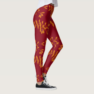 Oranje silhouetbladeren op rood leggings