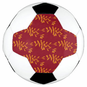 Oranje silhouetbladeren op rood voetbal