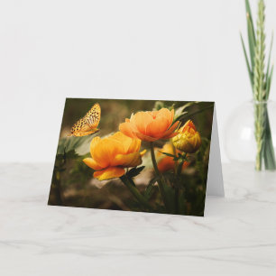 Oranje vlinder en bloemen kaart