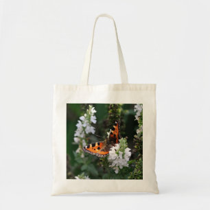 Oranje vlinder en witte bloesems tote bag