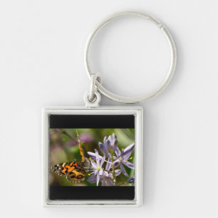 Oranje vlinder op Wilde Hyacinth Apparel & Gifts Sleutelhanger
