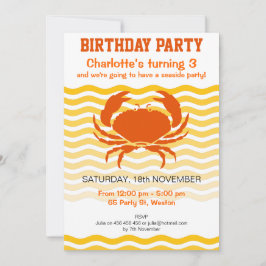 Oranje vlooienkrab op een zandige partij aan de ku kaart