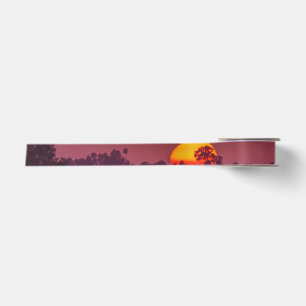 Oranje zon op roze Paarse lucht Foto Lint