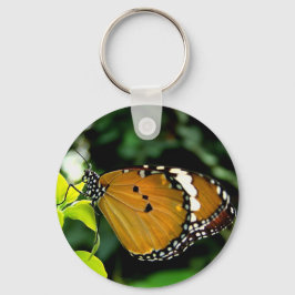 Oranje, zwarte en witte vlinder op leder sleutelhanger