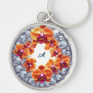 Orchideeënbloesems ingebed in kristallen sleutelhanger