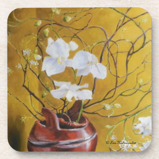 Orchidées dans des dessous de verre d'un vase à