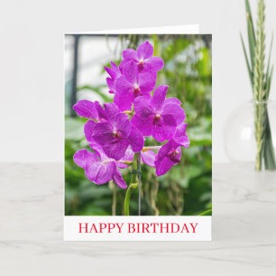 Orchidées près de la carte d'anniversaire