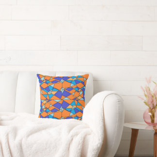 Oreiller bleu et orange avec motif géométrique