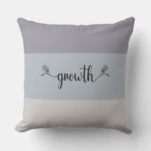 Oreiller jeté à motif rayé et écriture "Growth" au