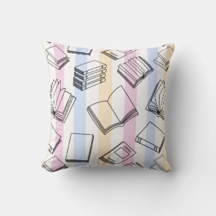 Oreiller jeté motif livre pastel