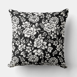 Oreiller noir et blanc à motif floral