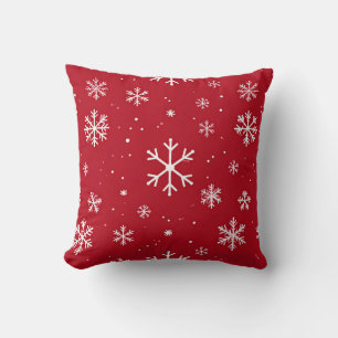 Oreiller rouge avec motif de flocon de neige blanc