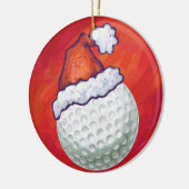 Ornement En Céramique Balle de golf avec chapeau de Père Noël sur fond r (Gauche)