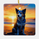 Ornement En Céramique Chien assis sur Ocean Beach au coucher du soleil<br><div class="desc">Un chien assis sur une plage à l'art du coucher du soleil. Dog thème personnalisé ornement de Noël.</div>
