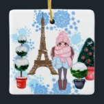 Ornement En Céramique Fille personnalisée à Paris Hiver Tour Eiffel<br><div class="desc">Ce magnifique décor de Noël en céramique à thème parisien présente une brune très chic, vêtue d'un adorable casquette et d'une écharpe avec l'expression "c'est un bébé d'hiver". La jeune fille se tient au milieu de topiaires enneigées décorées pour les vacances de Noël devant la Tour Eiffel. L'arrière - plan...</div>