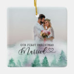 Ornement En Céramique First Christmas Married Winter Forest 2 Photo<br><div class="desc">Create your own double sided photo ornament with watercolor winter forest border. The wording reads "our first christmas married" in typewriter text and elegant calligraphy with a love heart. The photo template is set up for you to add 2 photos - one each side. You can also add your names...</div>