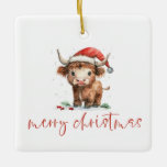 Ornement En Céramique Highland Cow Père Noël Nom du script Joyeux Noël<br><div class="desc">Highland Cow Père Noël Nom du script Joyeux Noël. La gentillesse festive pour le décor de Noël,  avec ce design amusant avec une vache de montagne douce dans son chapeau de Santa. Joyeux Noël est dans un script stylé.</div>