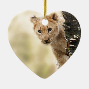 ORNEMENT EN CÉRAMIQUE LE PETIT LION CUB MIGNON S'ÉTENDENT