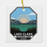 Ornement En Céramique Parc national du lac Clark Emblem rétro minimal<br><div class="desc">Design d'illustration vectorielle du lac Clark. Le parc est une terre d'une beauté époustouflante. La vapeur des volcans,  la course saumon,  le fourrage des ours et les montagnes escarpées se reflètent dans des lacs turquoise chatoyants.</div>