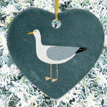 Ornement en céramique Seagull<br><div class="desc">Une mouette cheeky debout au bord de l'océan vert profond. Idéal pour les amateurs d'oiseaux sadiques et de la côte. Art original de Nic Squirrell.</div>