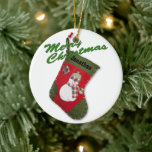 Ornement En Céramique Snowman Christmas Stocker Photo Nom personnalisé<br><div class="desc">Personnalisez cette conception traditionnelle de Noël rouge et vert, avec un bas avec un bonhomme de neige portant un foulard et un casquette. Un message de fête est à l'arrière. Remplissez les champs de modèle avant et arrière, retirez le texte ou cliquez sur customiser et sélectionnez un style, une taille...</div>