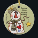 Ornement En Céramique Snowman primitif avec coeur et étoile<br><div class="desc">Un bonhomme de neige (bonhomme de neige) à l'apparence primitive tient une étoile et un coeur. Message que Christmas STARts dans nos COEURS! Design original par Christie Black de Creations from the Heart.</div>