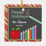 Ornement En Céramique Teacher Happy Holidays Chalkboard Apple<br><div class="desc">This Christmas tree ornament features a chalkboard,  a red apple and color pencils. The text on the chalkboard reads: Happy Holidays. Customizable text allows you to add the teacher's name and your own name. The makes an awesome Christmas keepsake gift for a special teacher.</div>