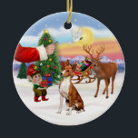 Ornement En Céramique Traite de Basenji<br><div class="desc">Père Noël offre un régal à ses Basenji car les elfes chargent le traîneau avant la grande nuit.</div>