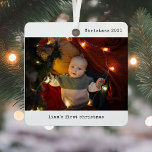 Ornement En Métal Personnalisé avec Photo Baby's First Christmas<br><div class="desc">Célébrez la toute première saison de vacances de votre petit avec l'Ornement de Noël Personnalisé avec Photo Baby. Cet ornement métallique à l'épreuve des éclats est le parfait souvenir pour honorer le premier Noël de votre bébé, avec deux photos de famille chères qui réchaufferont votre coeur année après année. Avec...</div>