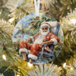 Ornement En Métal Plage tropicale Noël Père Noël Père Noël<br><div class="desc">Plage tropicale Noël Père Noël Père Noël Ornements présente un Père Noël festif se déroulant sur une plage tropicale. Pour plus de design visitez Evco Holidays www.zazzle.com/store/evcoholidays</div>