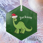 Ornement En Verre Cute Kids Christmas Dinosaur Vert Personnalisé<br><div class="desc">Dinosaure vert magnifique souriant et très mignon dans un chapeau de Noël rouge vacances. J'aime les animaux de Noël préhistoriques et les cadeaux que les enfants vont aimer. Customisez ce cadeau avec le nom du destinataire pour le rendre encore plus personnalisé.</div>