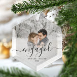 Ornement En Verre Premier Noël Engagé Photo personnalisée Script noi<br><div class="desc">Commémorez votre fiançailles avec ce magnifique ornement de gardien moderne. Le texte noir indique "Notre premier Noël engagé", avec le mot "engagé" dans un élégant script d'écriture manuscrite avec des fioritures avant et après. Remplacez l'exemple d'image par votre photo préférée, et ajoutez vos noms et l'année. Un filtre dégradé blanc...</div>