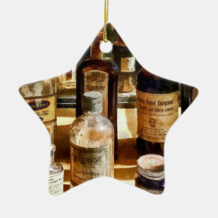 Ornement Étoile En Céramique Bouteilles de médicaments dans une armoire en verr