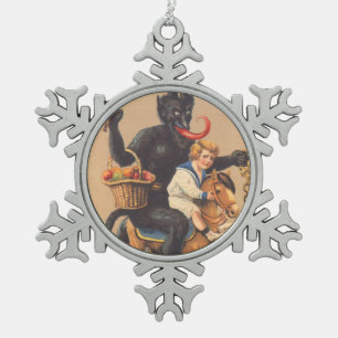 Ornement Flocon De Neige Krampus montant un cheval à bascule avec un garçon