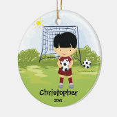 Ornement mignon de Noël de sport de footballeur (Gauche)