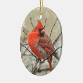 Ornement ovale comportant un cardinal de mâle (Gauche)