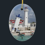 Ornement Ovale En Céramique Porto Morelos Lighthouse<br><div class="desc">Ornement en céramique ovale avec l'image d'un phare et d'une tour penchée à Puerto Morelos,  Quintana Roo,  Mexique. Revers rouge. Voir la collection complète de l'Ornement du Mexique dans la section HOME.</div>