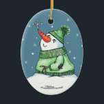 Ornement Ovale En Céramique Snowman avec Flocon de neige sur le nez<br><div class="desc">Snowman attrape un flocon de neige sur son nez ! Design original par Christie Black de Creations from the Heart.</div>