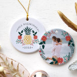 Ornement Rond En Céramique Mele Kalikimaka | Hawaiian Christmas Photo<br><div class="desc">Festive holiday ornament features a Christmas pineapple illustration flanked by red poinsettia flowers and green holly,  with the Hawaiian Christmas greeting "Mele Kalikimaka" curved above. Personalize with the year for a tropical chic holiday keepsake,  and add a favorite photo to the reverse side,  surrounded by matching lorals and branches.</div>