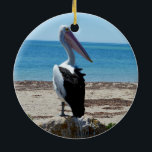Ornement Rond En Céramique Pelican on Beach Rock<br><div class="desc">Featured standing on a beach rock by the ocean is a hungry most handsome pelican waiting for tasy fish morsels.</div>