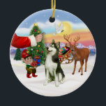 Ornement Rond En Céramique Treat for a Siberian Husky (#3)<br><div class="desc">Père Noël offre un régal à son Husky sibérien alors que les elfes chargent le traîneau avant la grande nuit.</div>