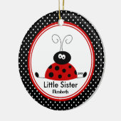 Ornement rouge de Noël de petite soeur de (Gauche)